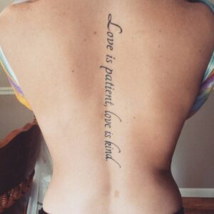 Back Tattoo Saying Love Is Patient Love Is Kind On