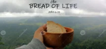 Bible Verse Quote I Am The Bread Of Life John 6 35 With Hand Of A Person Holding Bread On Wooden Bowl Mountain Background Stock Photo Image Of Dramatic Background 234306668