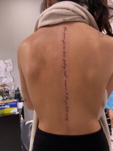 Fine Line Bible Verse Spine Tattoo